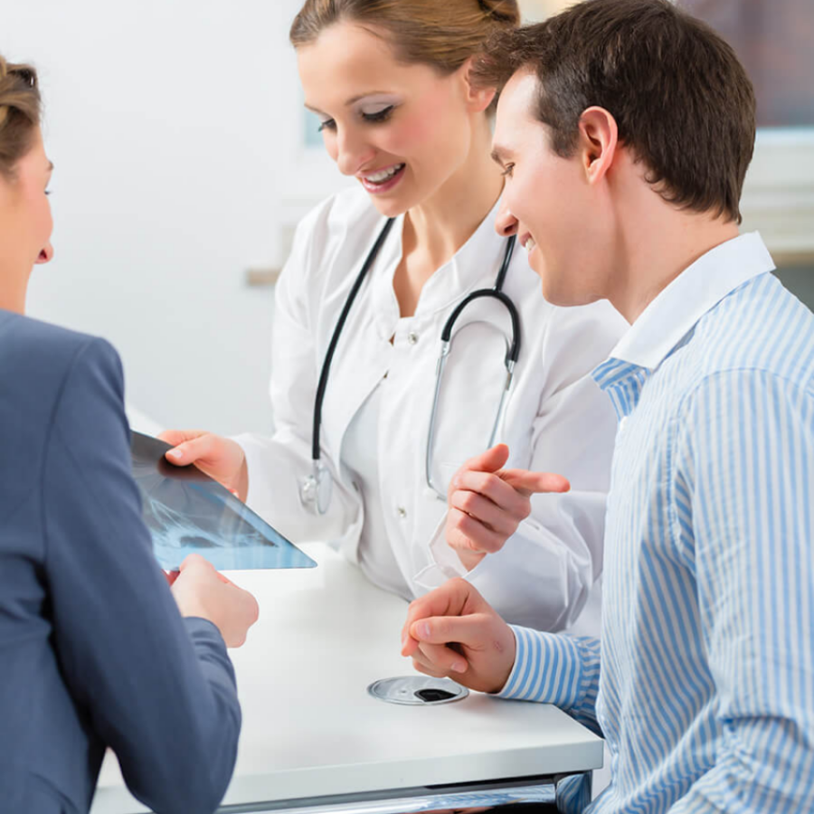 cropped female-doctor-with-her-patients-clinic-explaining-something cropped female-doctor-with-her-patients-clinic-explaining-something